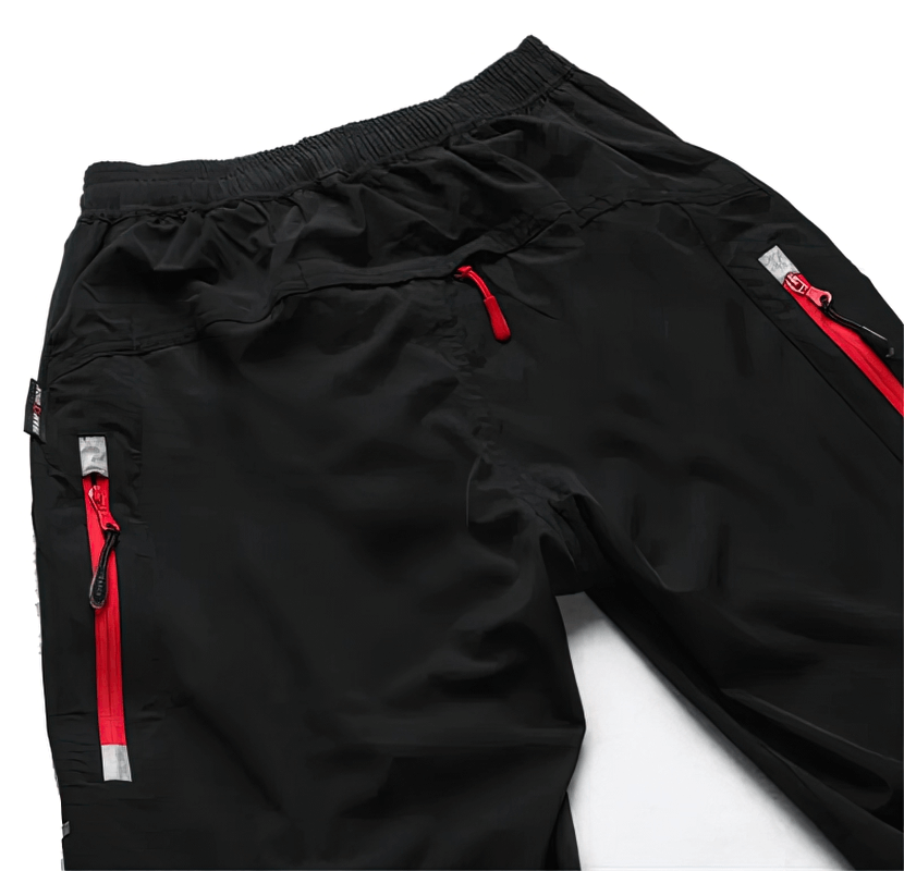 Black lightweight men's sweatpants with reflective stripes and zipper pockets, perfect for cycling. SF1624 model shown.
